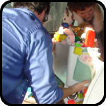 Doug and Kelly moving the Toylet